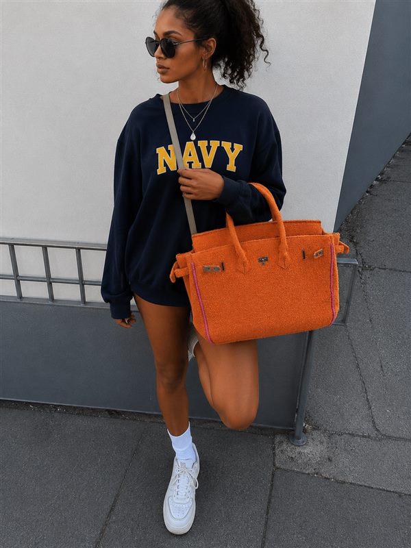 Soleia community member carrying a jelly tote